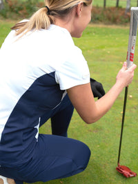 Viveka golf top white polo with navy blue panels in mesh fabric